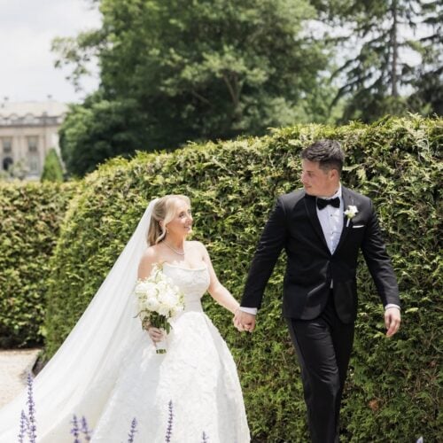 groom wearing black infinity tuxedo with bride
