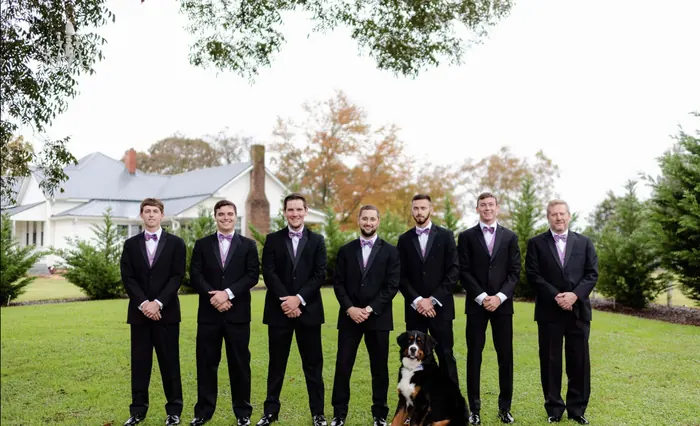 A wedding party of 8 groomsmen