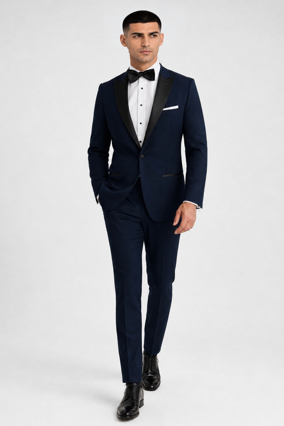 ntr-f13-p03-7cdec387b332 | National Tuxedo Rentals Navy Venice Tuxedo on a model, alternate view 1