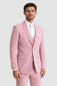 Man in a pastel pink suit with white shirt and tie, facing forward against a light background.