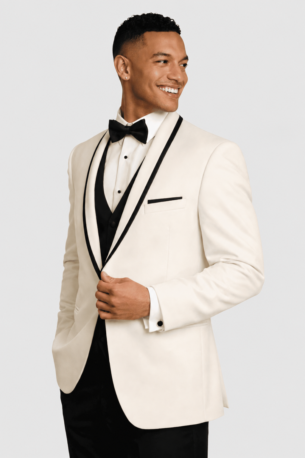 ntr-grey-20261007-5862-98f59b6f729b | National Tuxedo Rentals Smiling man in a cream tuxedo with black satin lapels, black bow tie, and pocket square.
